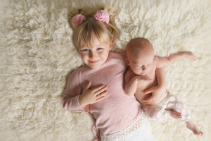 Seattle newborn photographer | newborn baby girl with sister