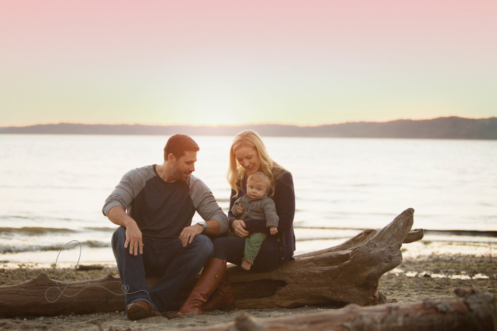 family of three on the beach