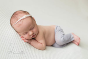 Seattle newborn baby girl side lying pose